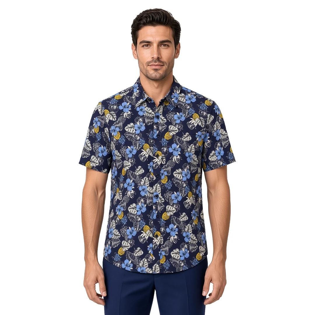 Men’s blue floral short sleeve shirt in cotton, navy ground with powder-blue hibiscus, grey monstera and yellow accents, soft collar, modern fit, worn untucked.