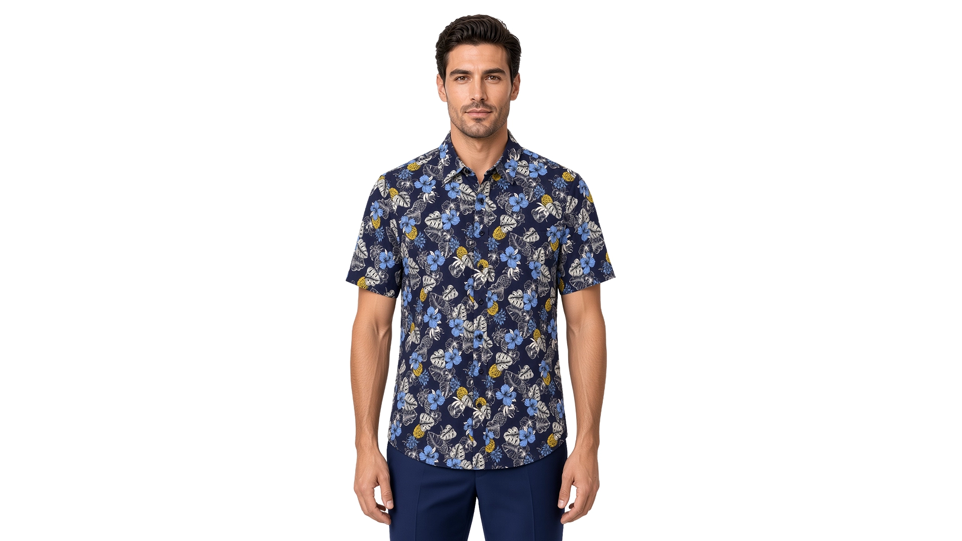 Men’s blue floral short sleeve shirt in cotton, navy ground with powder-blue hibiscus, grey monstera and yellow accents, soft collar, modern fit, worn untucked.