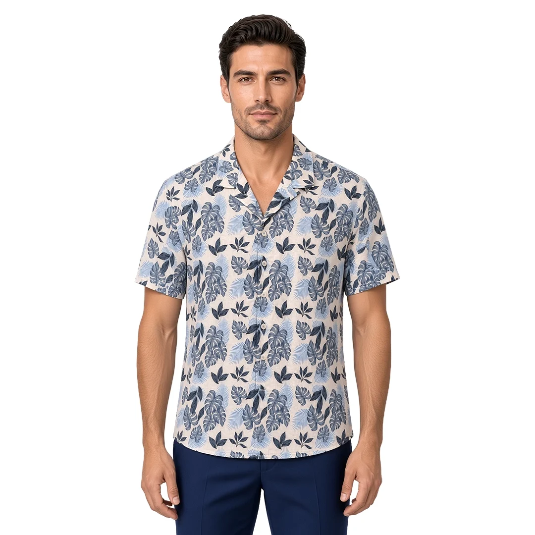 Men’s blue floral short sleeve Havana shirt in cotton, tropical leaf print in powder blue and slate on a cream ground, open camp collar, modern fit, worn untucked.