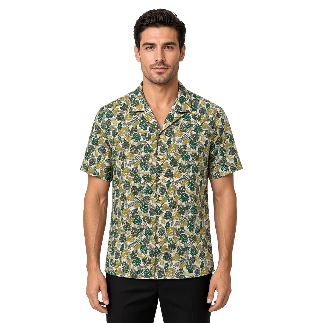Men’s green floral short sleeve Havana shirt in cotton, dense tropical leaf print, open camp collar, modern fit, worn untucked.